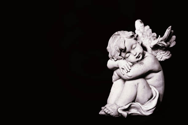 istock Angel isolated on black background 1125415952