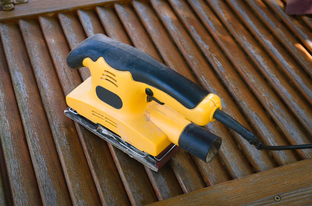 istock Close up of electric sander on maltese window 1125417670
