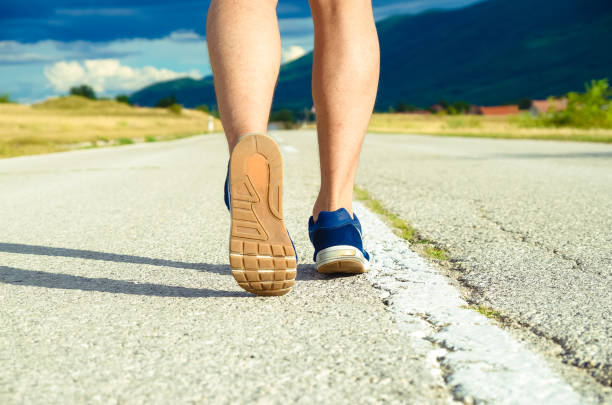 istock Sports man jogging in nature 1125417879