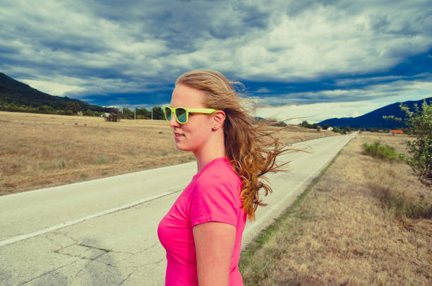 A girl wearing sunglasses went on a vacation trip