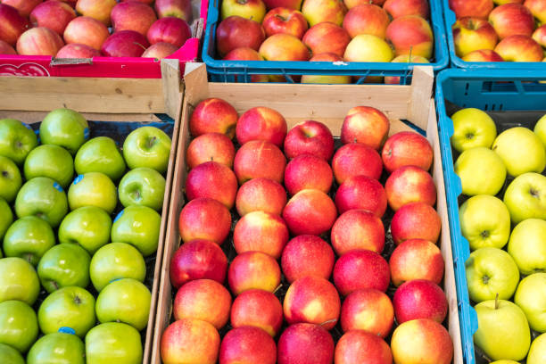 istock fresh red  and green apples in a market 1125419775