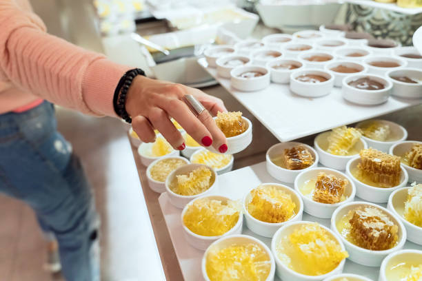 Taking honeycomb from breakfast buffet in a luxury hotel's restaurant
