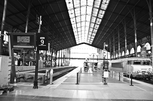 An empty platform 9 with a newly arrived SNCF train at Gare du Nord train station in Paris, Île-de-France.
