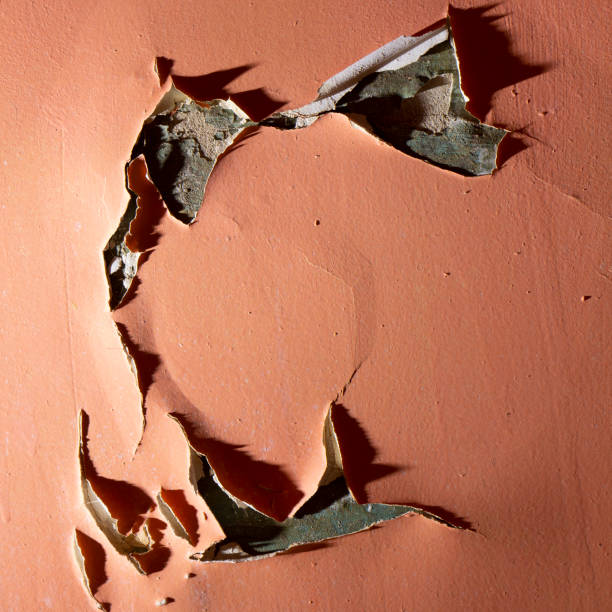 istock closeup of chipped paint on red wall 1125436247