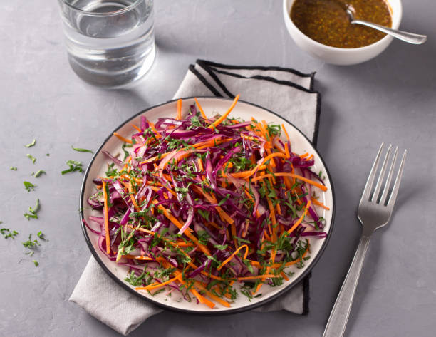 istock Red cabbage coleslaw salad with cumin and mustard sauce on gray background 1125436476