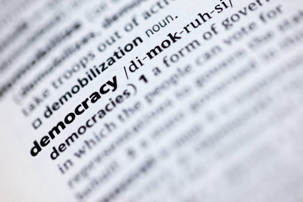 istock Close up to the dictionary definition of word Democracy 1125437277