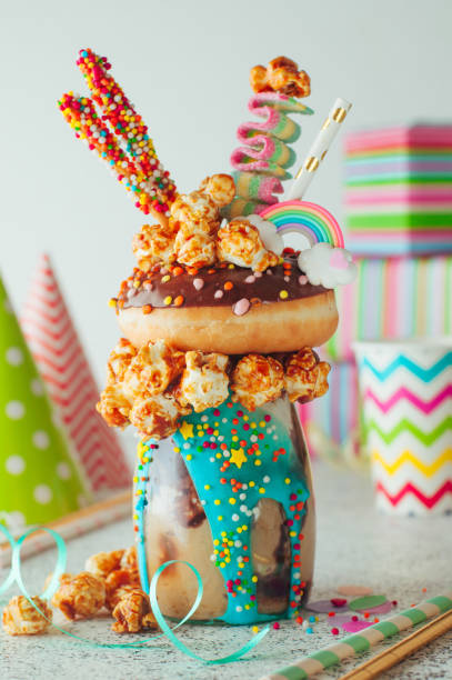 istock Chocolate freak shake topping with donut and caramel popcorn 1125438865
