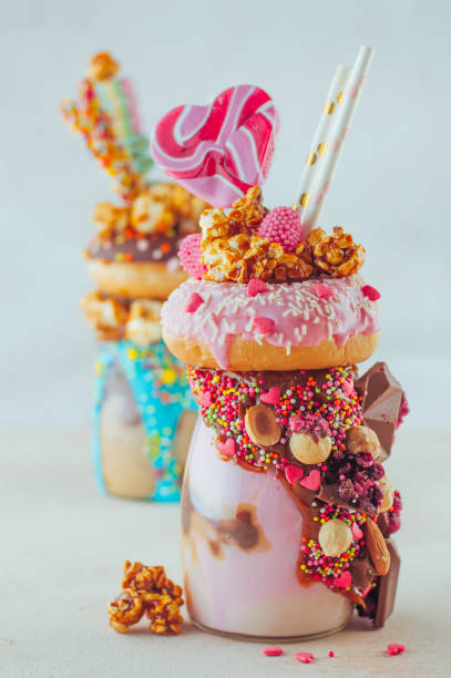 istock Valentines day raspberry freak shake topping with donut, caramel popcorn and sweets 1125439199