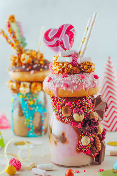 istock Raspberry freak shake topping with donut, caramel popcorn and sweets 1125439224