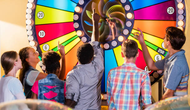 istock Multi-ethnic teenage friends in amusement arcade 1125439662