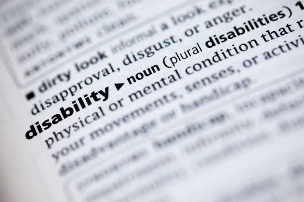 istock Close up to the dictionary definition of word Disability 1125439749