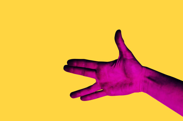 istock Isolated hand photo on yellow background. Pink hand collage style. Bright pop art 1125445556