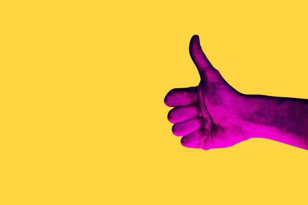 Isolated hand photo on yellow background. Pink hand collage style. Bright pop art Isolated hand photo on yellow background. Pink hand collage style. Bright pop art template with space for text. Creative minimalistic backdrop. psychedelic photos stock pictures, royalty-free photos & images