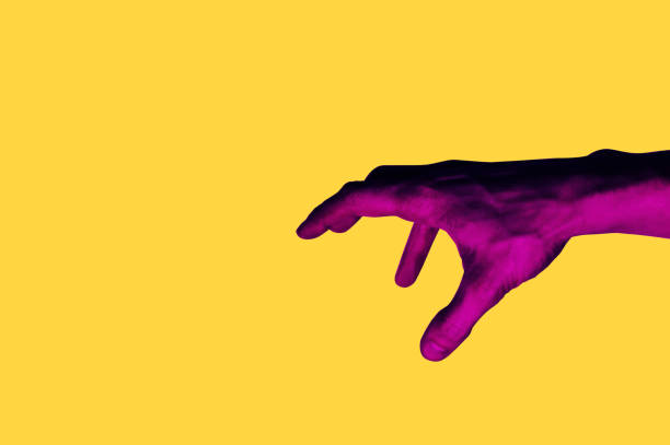 istock Isolated hand photo on yellow background. Pink hand collage style. Bright pop art 1125445652