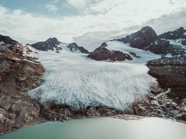 Photo from an expedition with a sailing boat through the beautiful vast landscape of huge icebergs and impressive mountainscapes in East Greenland.