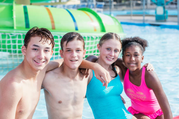istock Multi-ethnic teenagers having fun at water park 1125447187