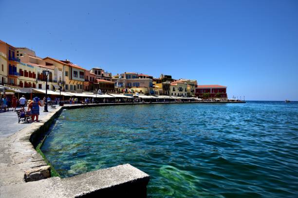 istock Visitors exploring the restaurants and shops of Chania harbour 1125447779
