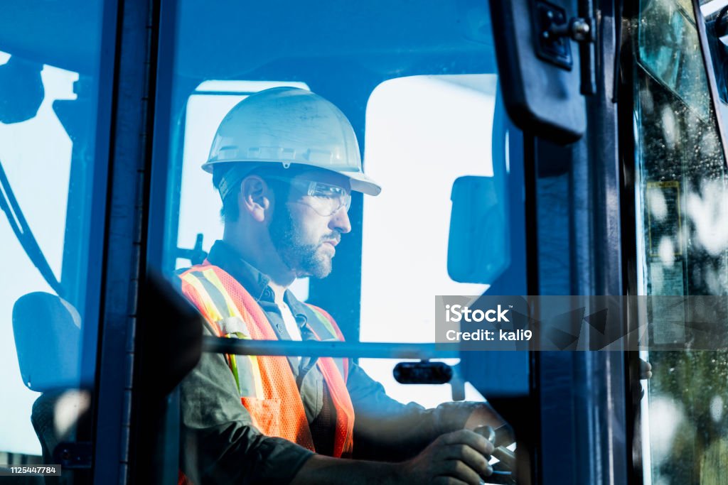 Man Operating Backhoe Construction Worker Operating A Backhoe Stock Photo - Download Image ...