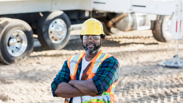istock African-American construction worker by crane 1125449131