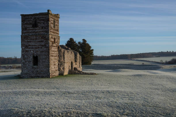 istock 12th Century Church and Earthworks, England 1125449149