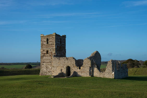 istock 12th Century Church and Earthworks, England 1125449341