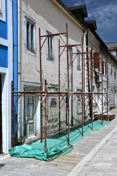 istock Painters working on the facade scaffolding 1125449557