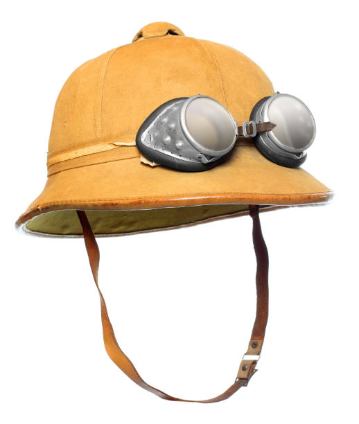 Pith helmet with motorcycle goggles. Protective wear for tropical destination.