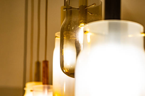 istock light bulb in between other light bulbs, great photo of a hanging light in between other lights, great warm colors 1125455333