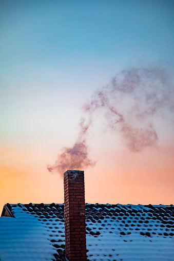 Smoking chimney air pollution at twilight