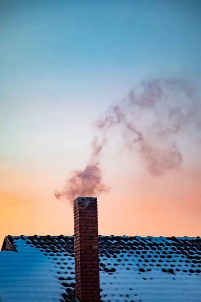 Smoking chimney air pollution at twilight