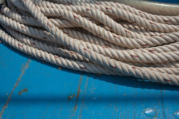Ship rope hank on turquoise wooden background