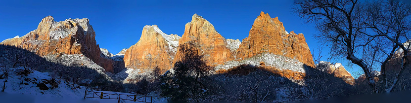 Panoramic view in winter of new snow on the peaks of the Court of the Patriarchs in Zion National Park in Utah