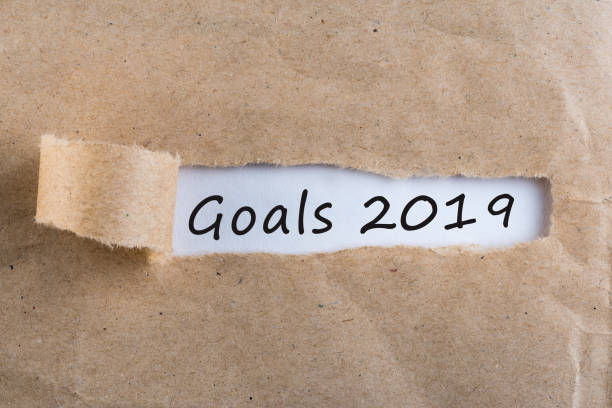 istock 2019 goals message at torn brown envelope. Business theme 1125462906