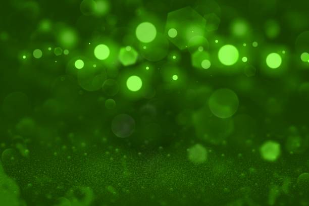 istock green nice glossy glitter lights defocused bokeh abstract background, festival mockup texture with blank space for your content 1125465370