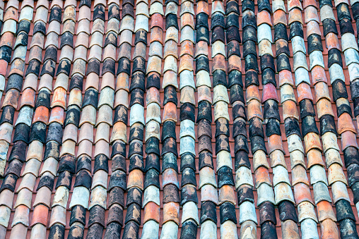 Pattern formed from very old roof tiles made of ceramic, clay in Ouro Preto, Minas Gerais, Brazil. Traditional roofing