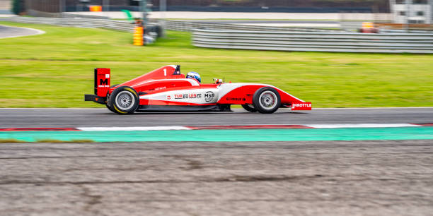 istock Red formula race car driving fast 1125471593