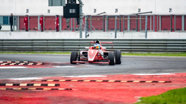 istock Red formula race car on the track 1125471609