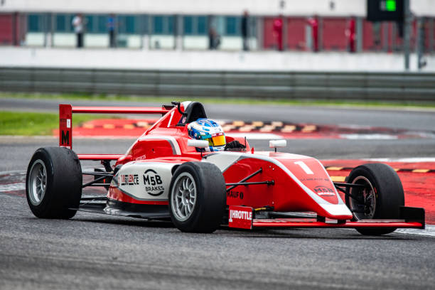 istock Red single-seater race car on the track 1125471629