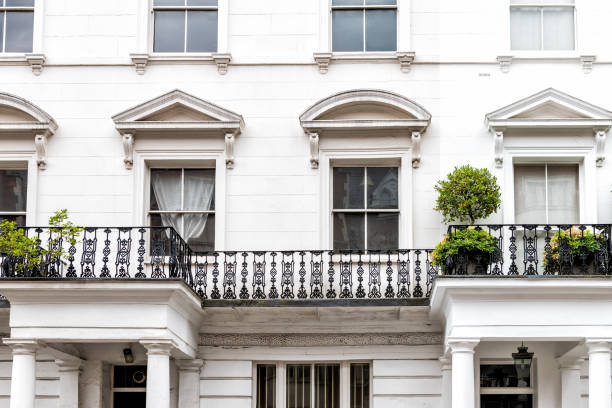 London, UK closeup of neighborhood district of Kensington luxury white architecture and nobody terraced buildings balconies London, UK closeup of neighborhood district of Kensington luxury white architecture and nobody terraced buildings balconies flat shoe photos stock pictures, royalty-free photos & images