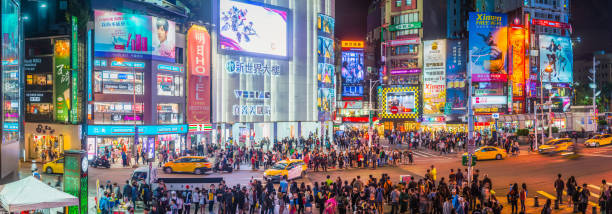 taipei nightlife crowds shoppers beneath neon signs ximending panorama taiwan - taipei imagens e fotografias de stock