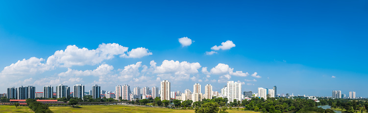 Big panoramic blue skies over the futuristic high rise housing of Jurong in central Singapore.