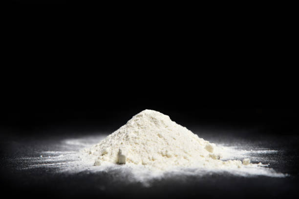 istock Flour scattered on a black background 1125476429