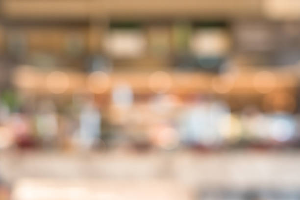 istock Open kitchen blur background in luxury hotel restaurant facility showing chef cooking over blurry food counter for buffet catering service 1125484070