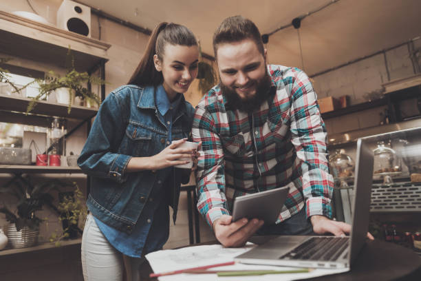 istock Young man and woman are looking into tablet. 1125484295
