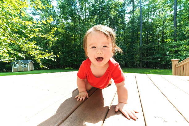 istock Happy toddler boy playing outside 1125484466