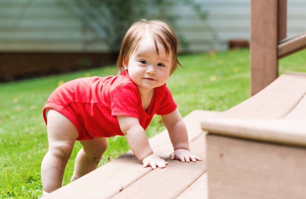 istock Happy baby boy playing outside 1125484503