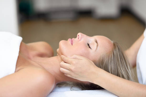istock Young woman receiving a head massage 1125485675