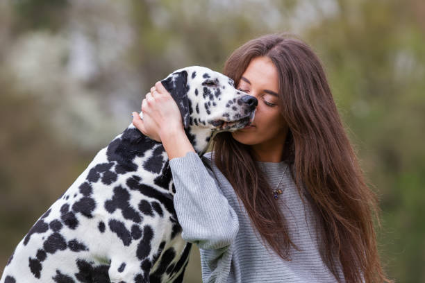 istock young woman with Dalmatian dog 1125486565