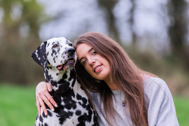 istock young woman with Dalmatian dog 1125486583