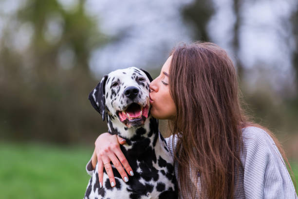 istock young woman with Dalmatian dog 1125486586